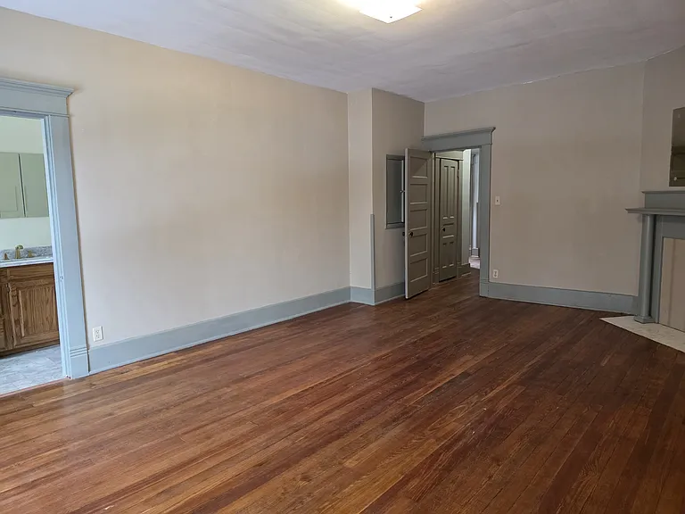 In the master bedroom looking toward the door and a small storage closet.