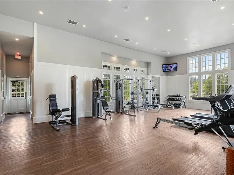 Stay active in the fully-equipped fitness center at The Cottages of Hattiesburg.