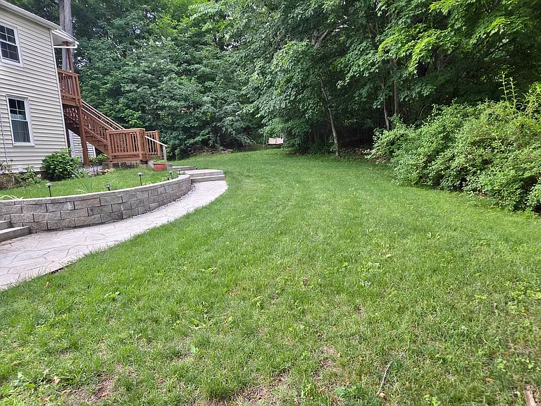 Large front yard and maintained gardens
