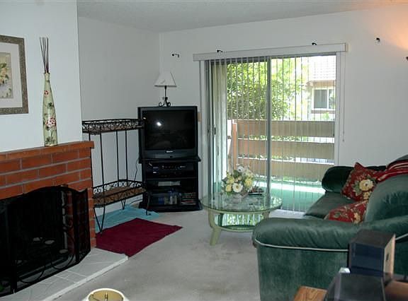 Living Room with Fireplace and Balcony