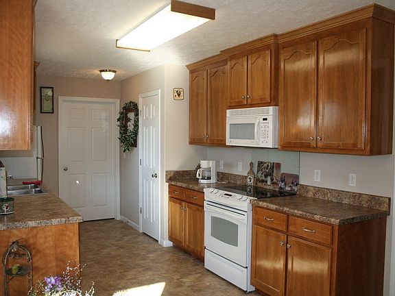 The kitchen is very workable and has lovely natural medium tone cabinets.