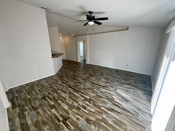 Spacious living room with plenty of natural light and room for the whole family.
