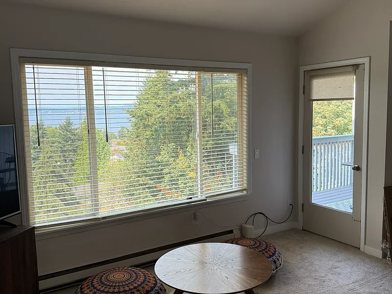 living room showing door to outside deck