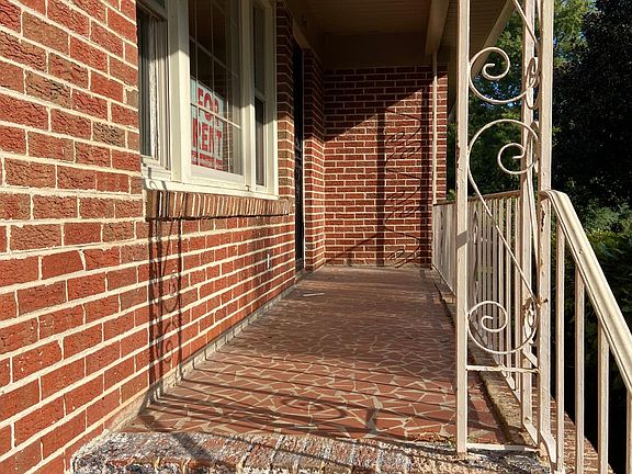 Walking from the driveway onto the front porch.