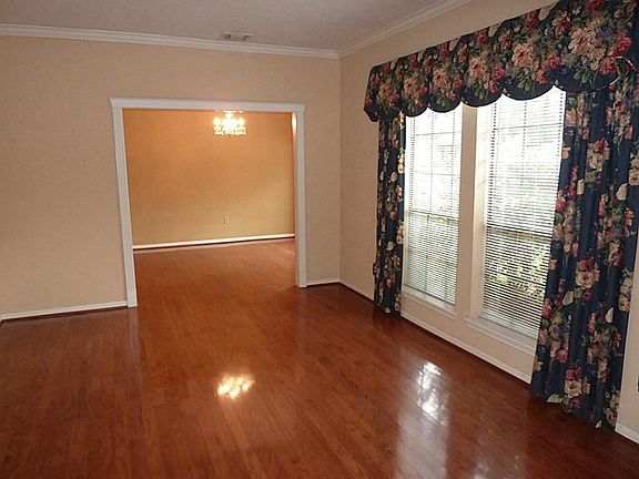 Formal living room leads to formal dining room