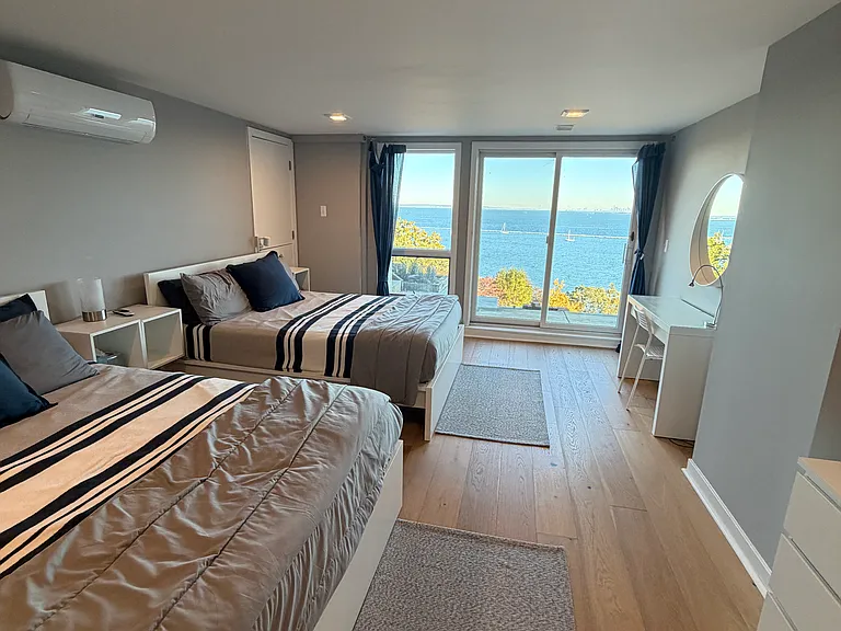 Lower level bedroom, has en suite bathroom and 2 queen beds.