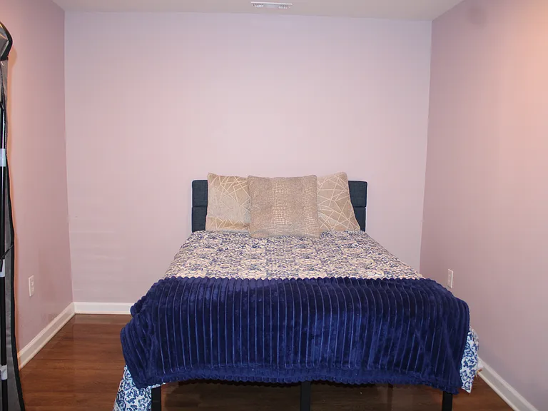 Private bedroom includes bed and moveable clothes closet