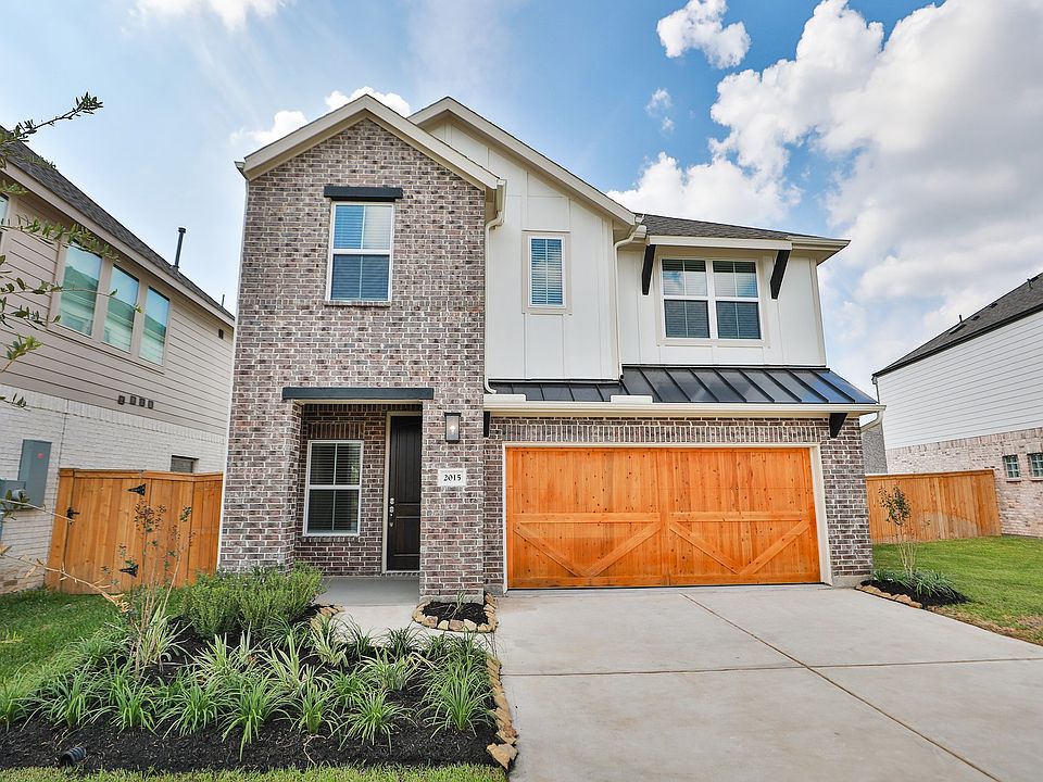 Elegant gable roof and brick facade meet sophisticated siding, crafting luxury in Park at Eldridge.