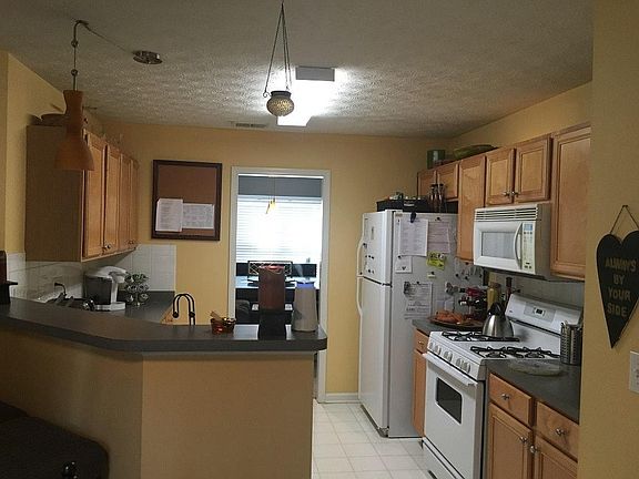 view of kitchen and formal dining from breakfast area