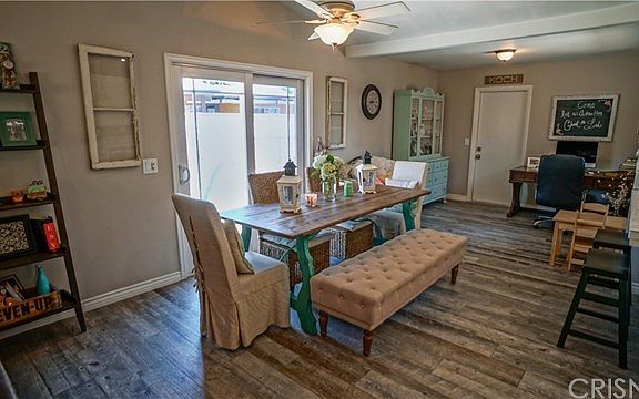 Tile flooring throughout from this office to dining to living. Dining has slider to firepit and spa 