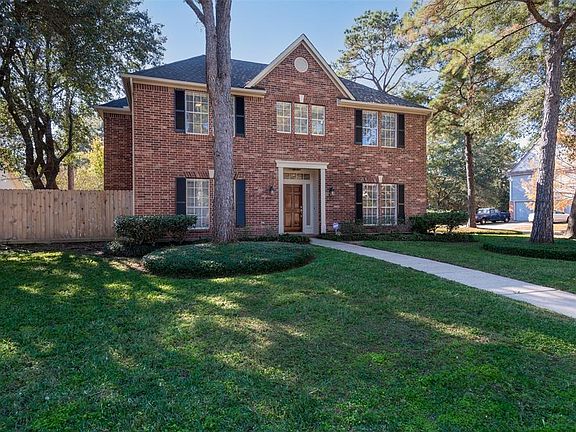 The home has stately red brick, elegant shutters, a fresh roof and fence. The long sidewalk and fresh landscaping make this home