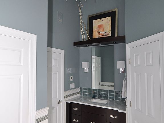 Remodeled bath with marble floors.