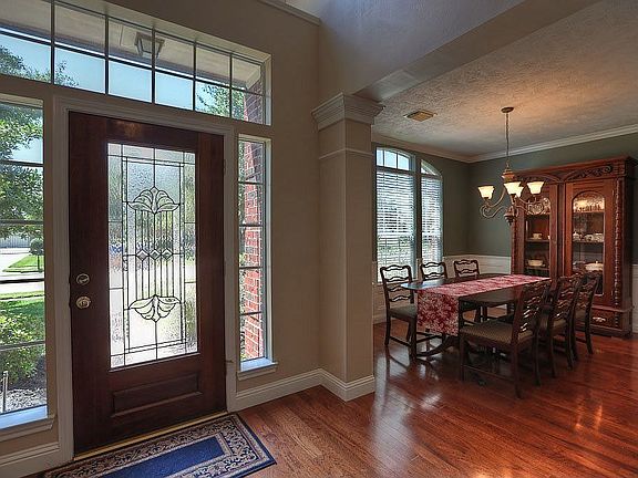 A beveled glass front door leads into the gorgeous entryway