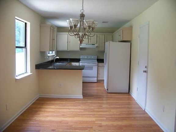 Renovated kitchen with granite and breakfast area