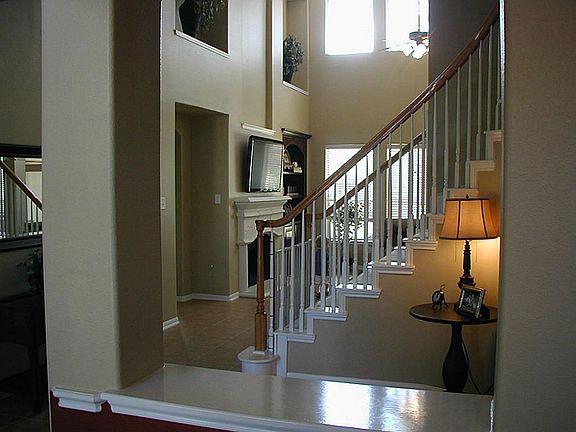 Come, join our tour... stepping inside the main entrance you are greeted by  the open & airy den entry in front of you.