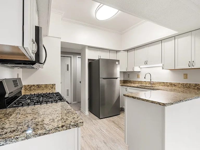 White kitchen with stainless steel appliance package