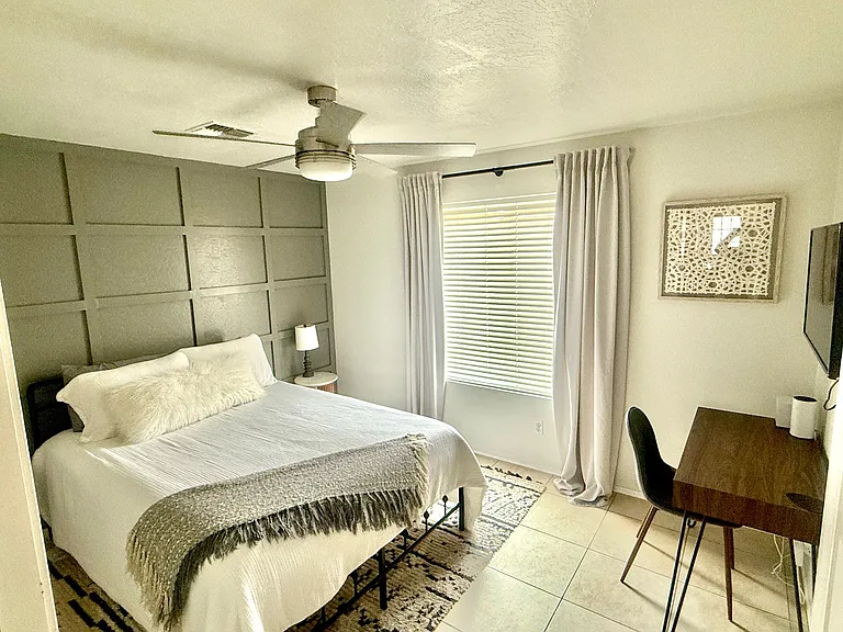 Queen Bedroom 1 with desk, TV, walk in closet