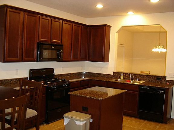 "42 CHERRY MAPLE CABINETS & GRANITE ISLAND KITCHEN