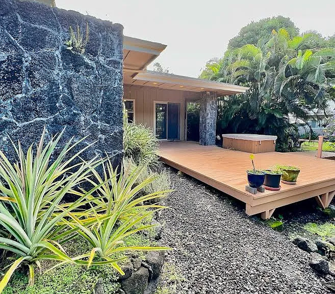 Back covered lanai, deck and hot tub.