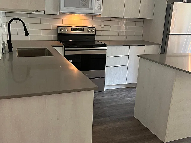 Kitchen is shiny new.