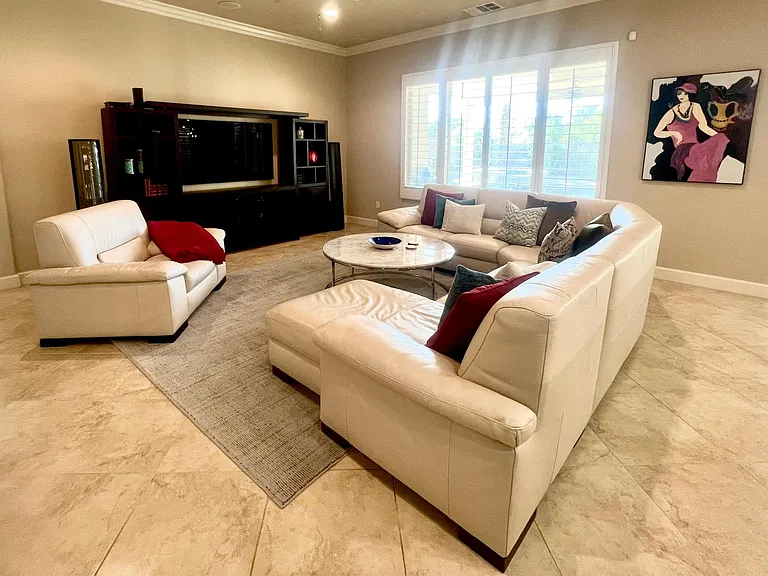 Uncluttered, only what's necessary for entertaining & comfort in the family room.