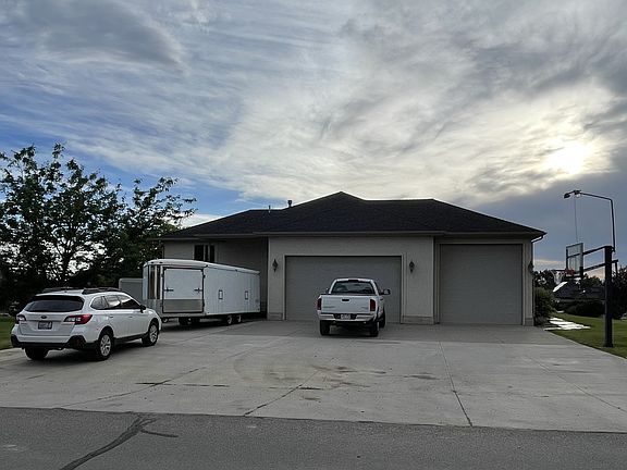 Driveway, parking on right side of driveway(behind 3rd car garage or behind trailer on left)