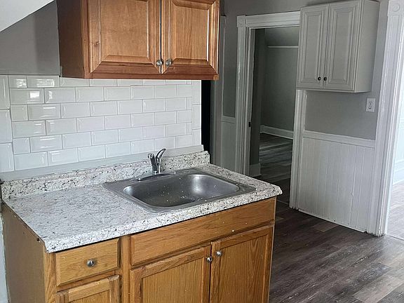 New tile backsplash over kitchen sink