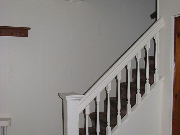 Stairway leading to upstairs bedrooms and bathroom