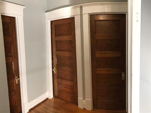Oak doors with brass hardware throughout