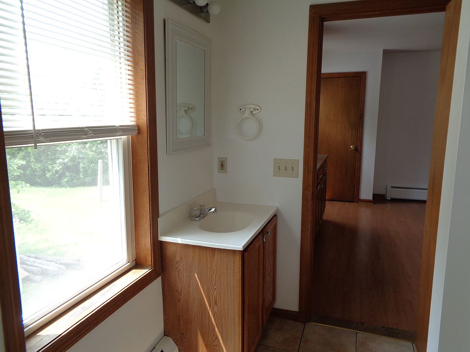 Another view of bathroom off kitchen. Freshly painted last year. No additional wall mounted shelves/rods/hooks allowed.