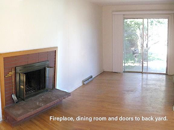 Fireplace, dining room and patio doors.