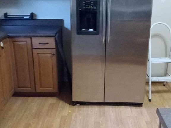 Refrigerator has water dispenser and ice make her with new water filter. Freezer on one side refrigerator on the other side by side