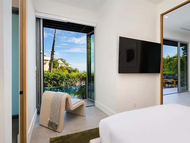 Guest bedroom #4 with a king size bed, Smart TV and full bathroom.