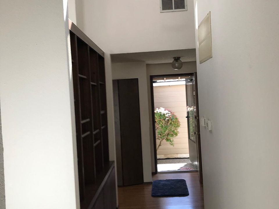 Entryway with built in bookcase