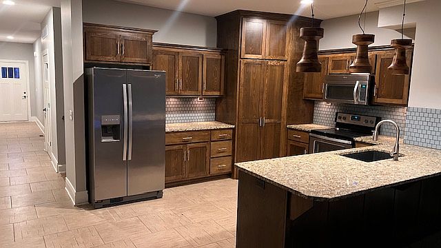Fully Equipped Kitchen With Walk In Pantry, Custom Cabinets and Contemporary Finishes.