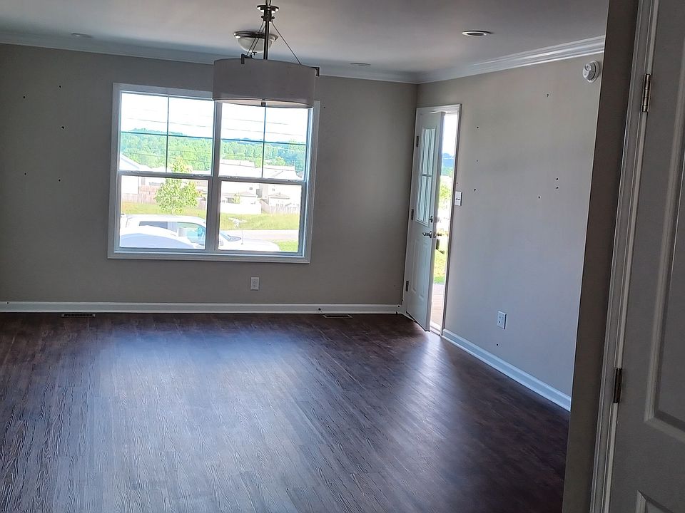 Living room and front entrance.