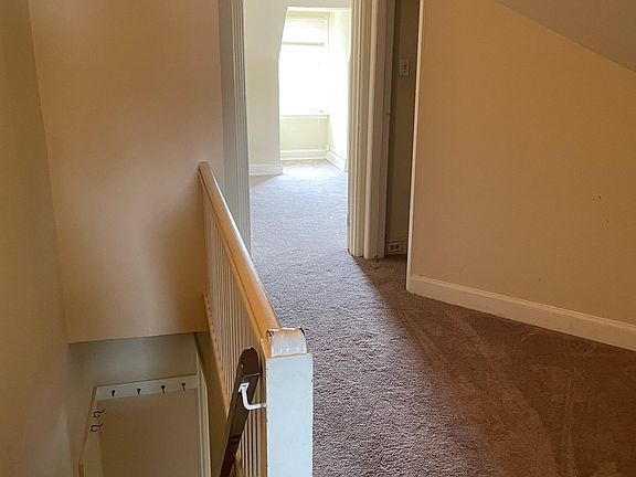 Third floor hallway and entrance to storage closet