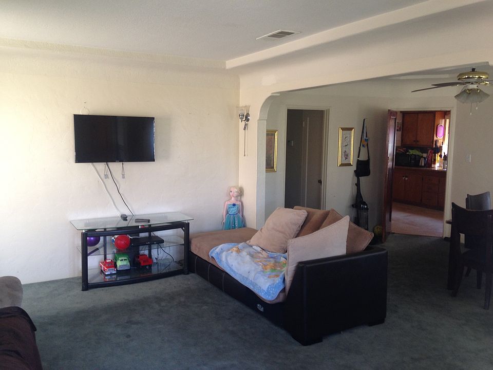 OLD PICTURE. Living room will have new paint, hardwood floor