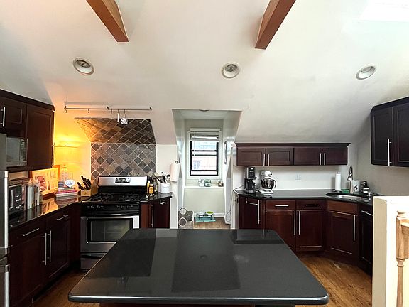 kitchen with island countertop for breakfast bar