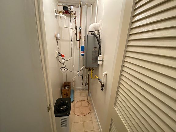 Utility Closed with tankless hot water heater (gas)
