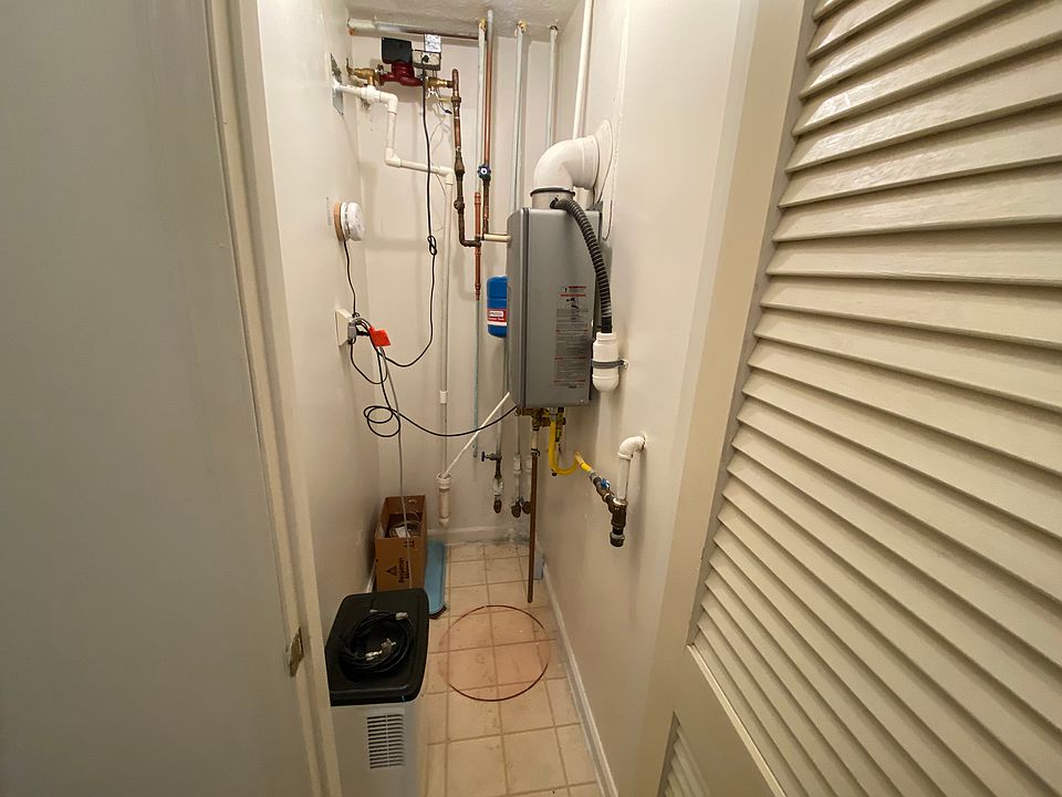 Utility Closed with tankless hot water heater (gas)