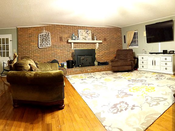 Den, wood burning fireplace