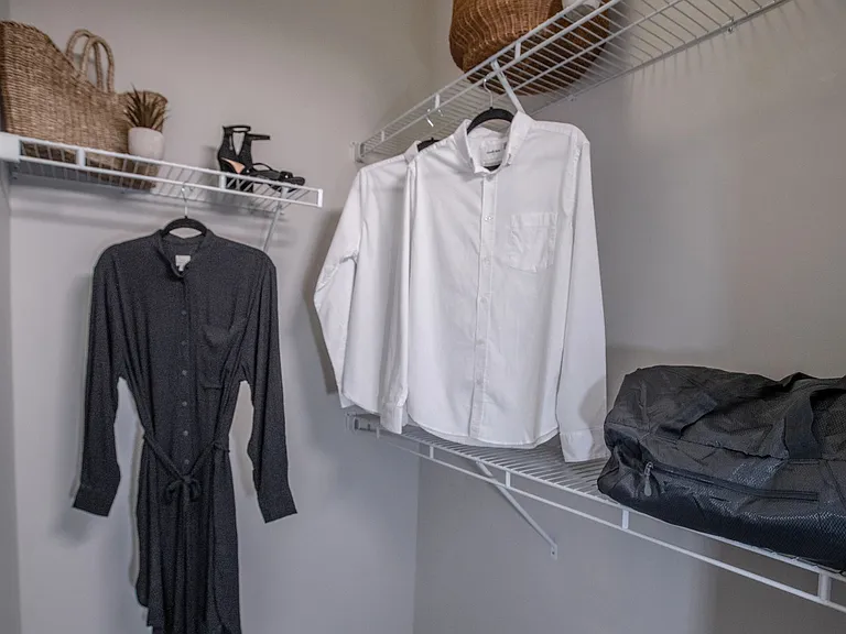 Revel in roomy bedroom closets equipped with built-in organizers for effortless storage.