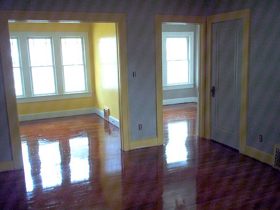 Kiving room looking towards sunroom and second bedroom looki