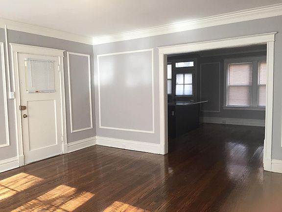 View from living room showing entrsnce to the apartment into the kitchen