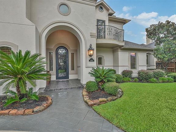 Professionally Landscaped; Outstanding stucco elevation; This beautiful home offers a circle stone-paver driveway