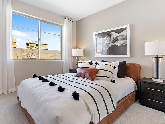 Guest bedroom located on the first floor for guest privacy. With carpet flooring and a window overlo