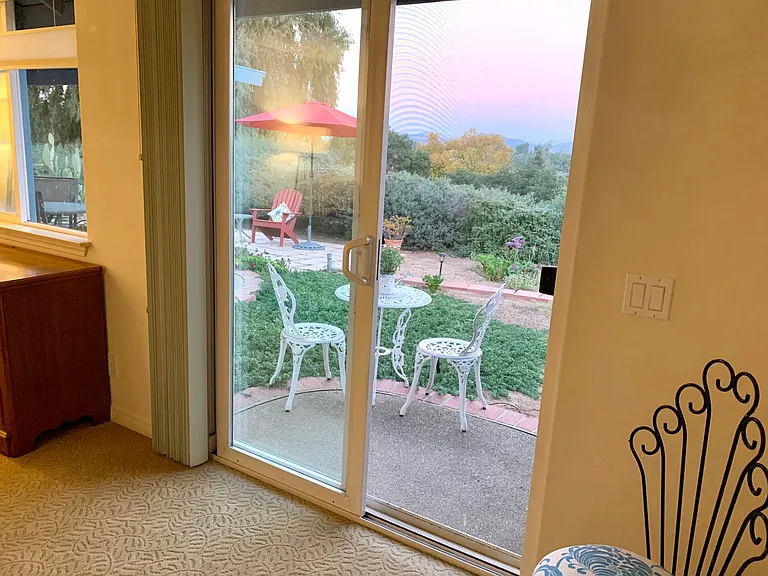 View of the master suite patio out of the sliding glass window.