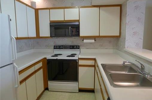 Efficiently designed kitchen with ample storage and counter