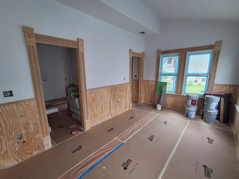 View from office into dining room, looking south with kitchen to the left.